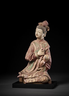 Lot 404 - A GESSO-PAINTED STUCCO FIGURE OF A BREASTFEEDING LADY, EARLY TO MID-QING