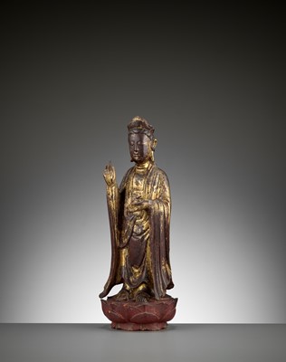 Lot 583 - A RED AND GILT-LACQUERED WOOD FIGURE OF GUANYIN, 17TH - 18TH CENTURY