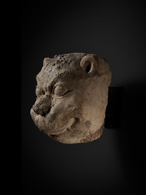 Lot 266 - A STUCCO HEAD OF A GUARDIAN LION, MON-DVARAVATI PERIOD