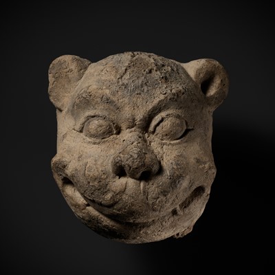 Lot 266 - A STUCCO HEAD OF A GUARDIAN LION, MON-DVARAVATI PERIOD