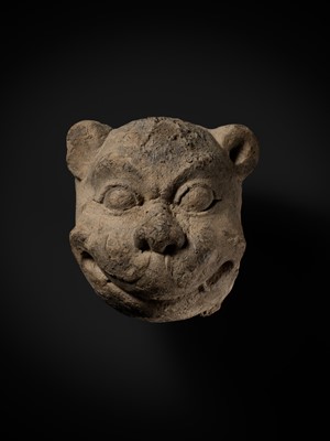 Lot 266 - A STUCCO HEAD OF A GUARDIAN LION, MON-DVARAVATI PERIOD