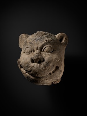Lot 266 - A STUCCO HEAD OF A GUARDIAN LION, MON-DVARAVATI PERIOD