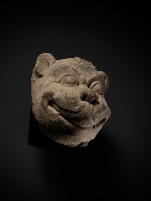Lot 266 - A STUCCO HEAD OF A GUARDIAN LION, MON-DVARAVATI PERIOD