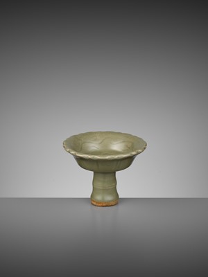Lot 721 - A LONGQUAN CELADON ‘BAMBOO’ BARBED-RIM STEM CUP, YUAN TO EARLY MING