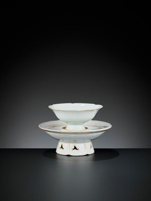 Lot 159 - A QINGBAI FLORAL-LOBED CUP AND STAND, SONG DYNASTY