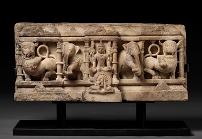 Lot 599 - A LARGE WHITE MARBLE PARIKARA FRAGMENT, JAIN, 12TH CENTURY