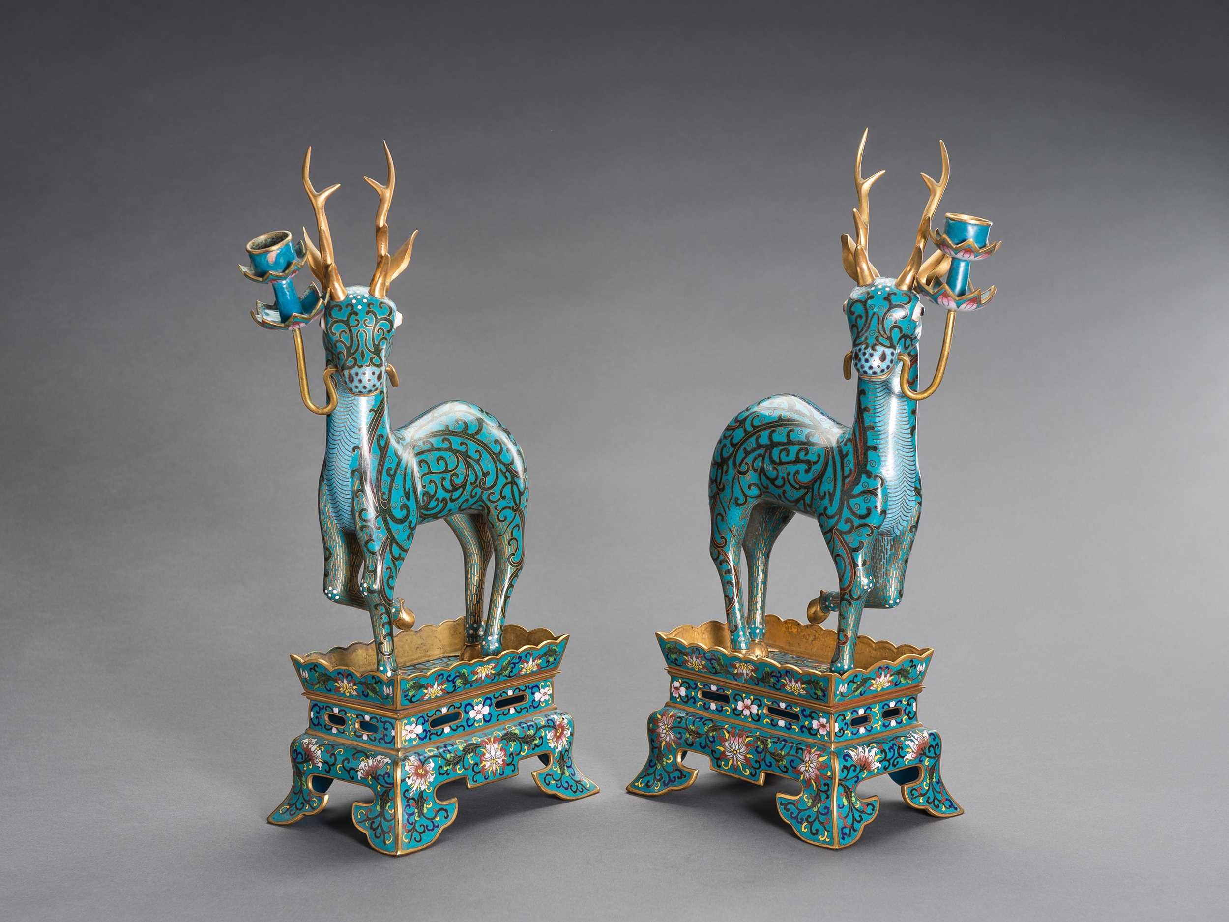 Lot 77 - A PAIR OF CLOISONNÉ DEER CANDLE HOLDERS