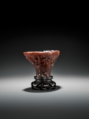 Lot 466 - A RHINOCEROS HORN ‘CHILONG AND PRUNUS’ LIBATION CUP, EARLY TO MID-QING