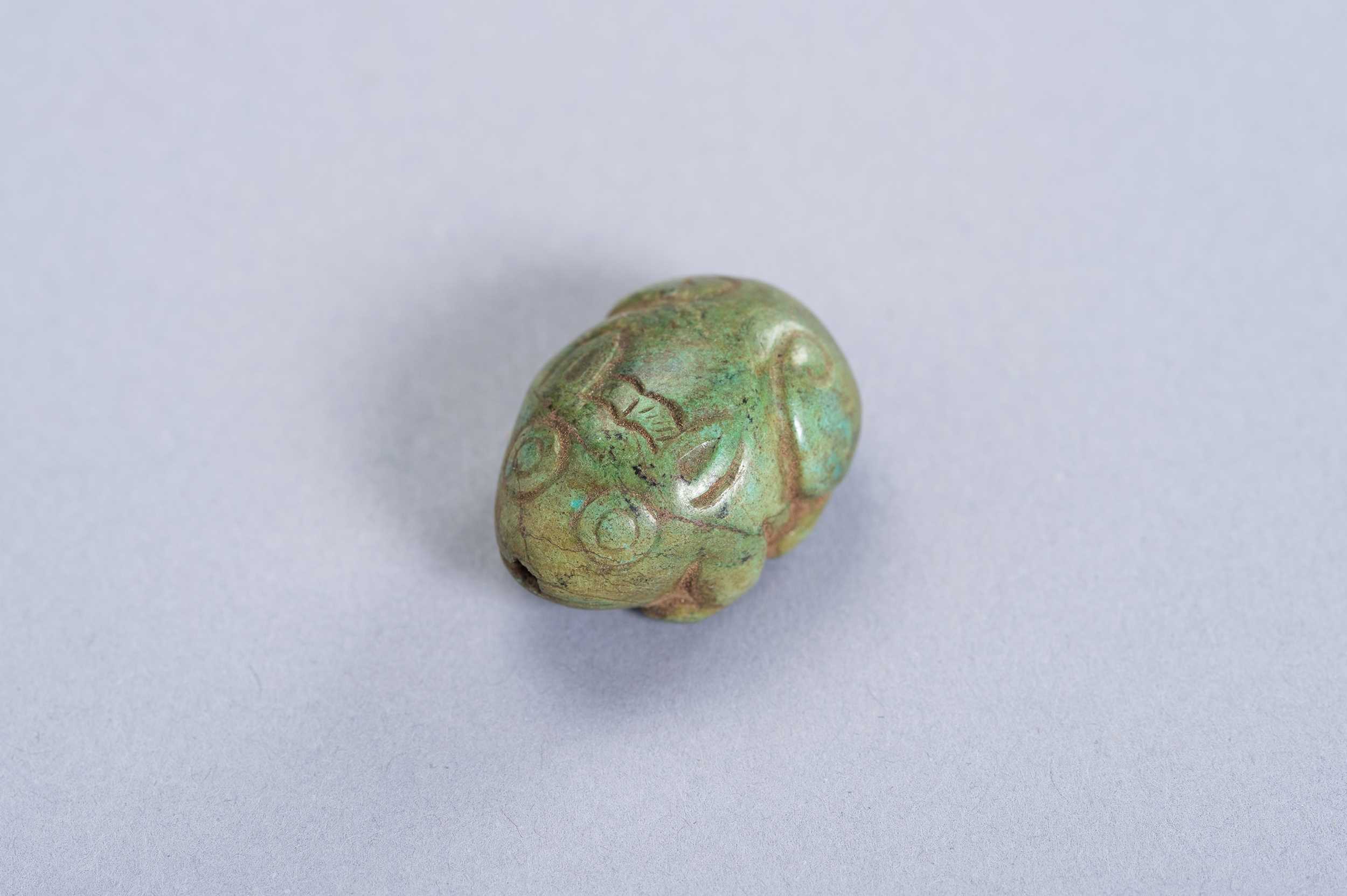 Lot 229 - A TURQUOISE PENDANT DEPICTING A HARE