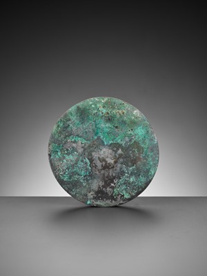 Lot 344 - A SILVERED BRONZE ‘LION AND GRAPEVINE’ MIRROR, TANG DYNASTY