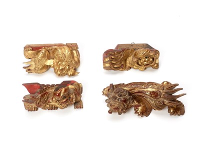 Lot 139 - FOUR CHINESE GILT LACQUERED BUDDHIST LION WALL HANGINGS