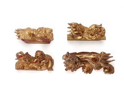 Lot 139 - FOUR CHINESE GILT LACQUERED BUDDHIST LION WALL HANGINGS