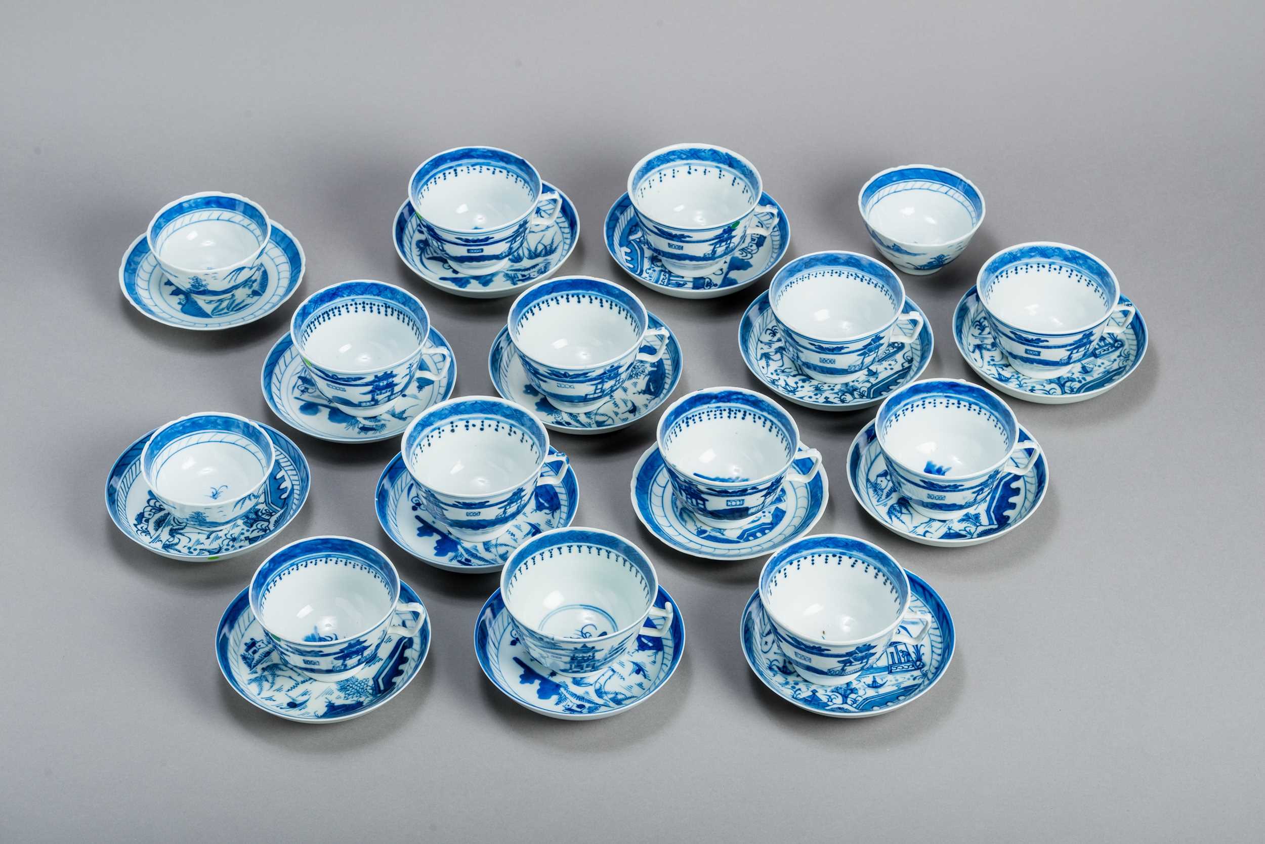 Lot 355 - A SET OF 15 BLUE AND WHITE CANTON TEACUPS AND 14 COASTERS