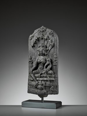 Lot 595 - A RARE BLACK STONE STELE DEPICTING MANASA, PALA PERIOD