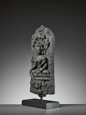 Lot 595 - A RARE BLACK STONE STELE DEPICTING MANASA, PALA PERIOD