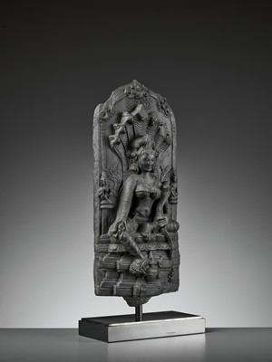 Lot 595 - A RARE BLACK STONE STELE DEPICTING MANASA, PALA PERIOD