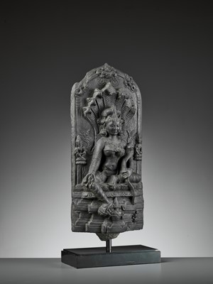Lot 595 - A RARE BLACK STONE STELE DEPICTING MANASA, PALA PERIOD