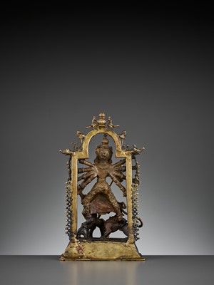 Lot 609 - A BRASS SHRINE DEPICTING DURGA SLAYING THE BUFFALO