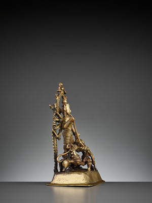 Lot 609 - A BRASS SHRINE DEPICTING DURGA SLAYING THE BUFFALO