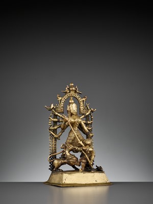 Lot 609 - A BRASS SHRINE DEPICTING DURGA SLAYING THE BUFFALO
