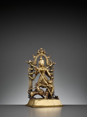 Lot 609 - A BRASS SHRINE DEPICTING DURGA SLAYING THE BUFFALO
