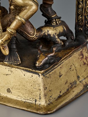 Lot 609 - A BRASS SHRINE DEPICTING DURGA SLAYING THE BUFFALO