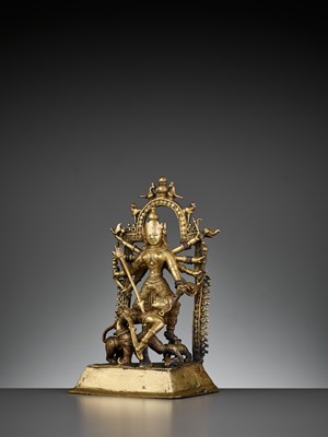 Lot 609 - A BRASS SHRINE DEPICTING DURGA SLAYING THE BUFFALO