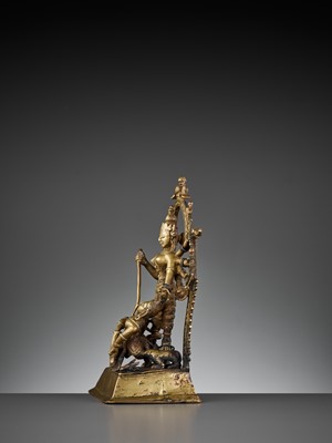 Lot 609 - A BRASS SHRINE DEPICTING DURGA SLAYING THE BUFFALO
