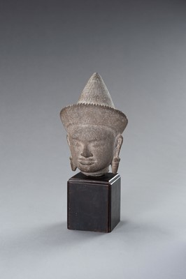 Lot 1332 - A MUSEUM COPY OF A KHMER STONE HEAD