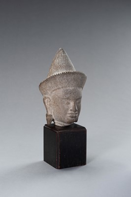 Lot 1332 - A MUSEUM COPY OF A KHMER STONE HEAD