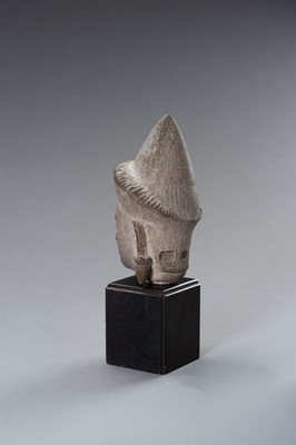 Lot 1332 - A MUSEUM COPY OF A KHMER STONE HEAD