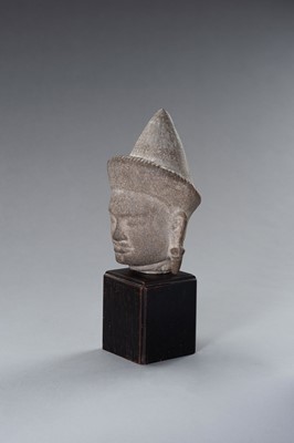 Lot 1332 - A MUSEUM COPY OF A KHMER STONE HEAD