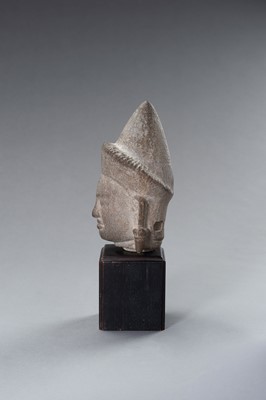 Lot 1332 - A MUSEUM COPY OF A KHMER STONE HEAD