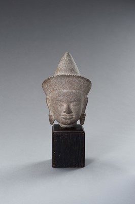 Lot 1332 - A MUSEUM COPY OF A KHMER STONE HEAD