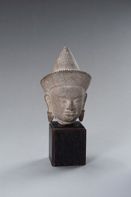 Lot 1332 - A MUSEUM COPY OF A KHMER STONE HEAD