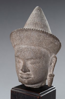 Lot 1332 - A MUSEUM COPY OF A KHMER STONE HEAD