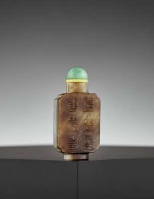 Lot 299 - AN INSCRIBED PALE CELADON AND BROWN JADE SNUFF BOTTLE, MID-QING