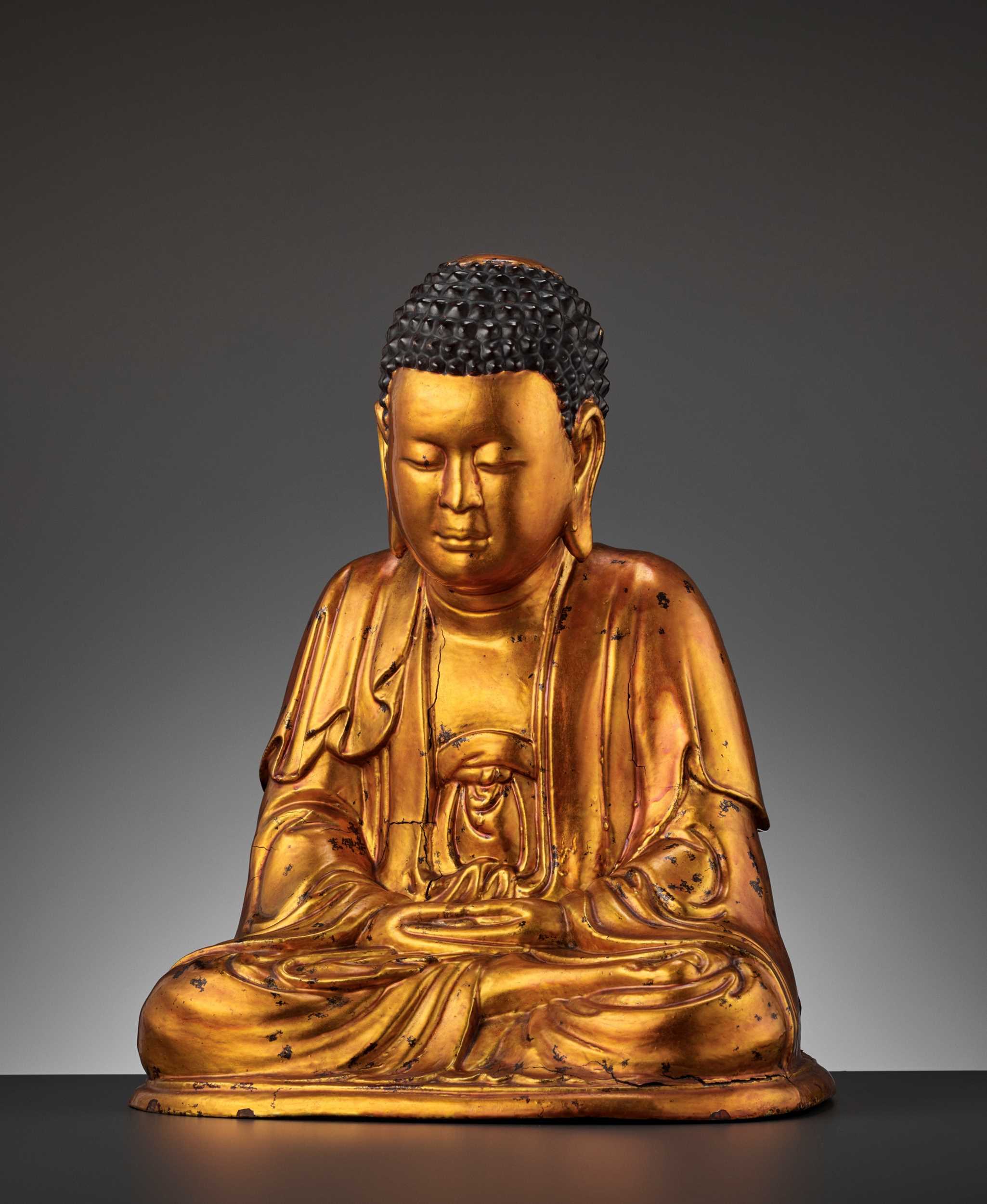 Lot 584 - A MASSIVE GILT-LACQUERED WOOD FIGURE OF BUDDHA, 18TH-19TH CENTURY