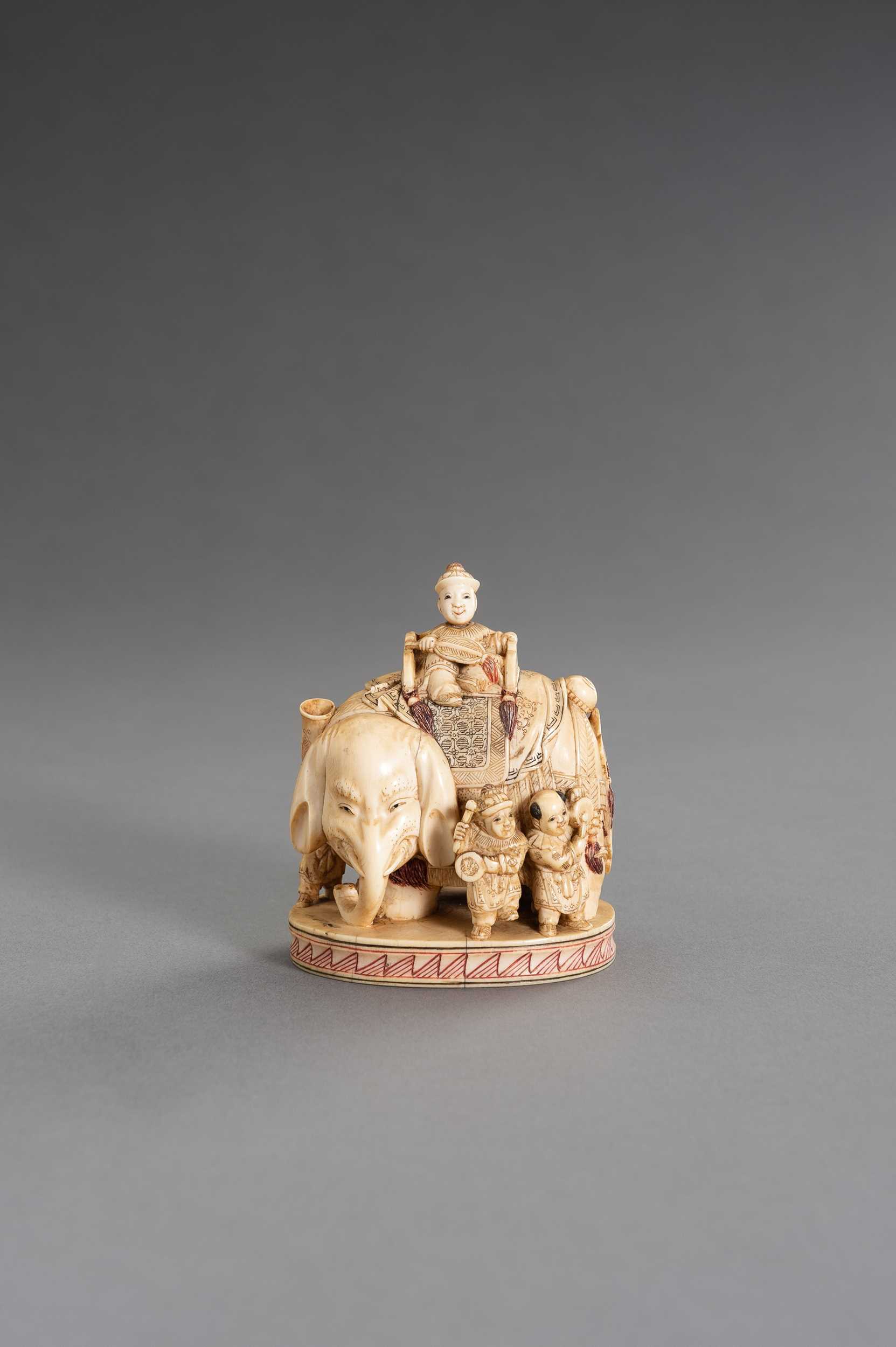Lot 250 - CHIKUYÔSAI TOMOCHIKA: AN IMPRESSIVE IVORY OKIMONO OF A CAPARISONED ELEPHANT WITH BOYS