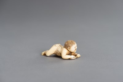 Lot 408 - MASATSUGU: A FINE IVORY NETSUKE OF A CRAWLING INFANT