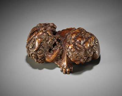 Lot 272 - A SUPERB AND LARGE BAMBOO NETSUKE OF A BUDDHIST LION WITH CUB