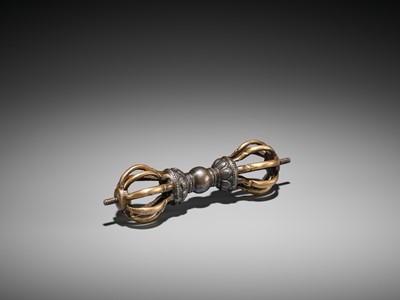 Lot 426 - A GILT-BRONZE AND IRON VAJRA, 17TH CENTURY