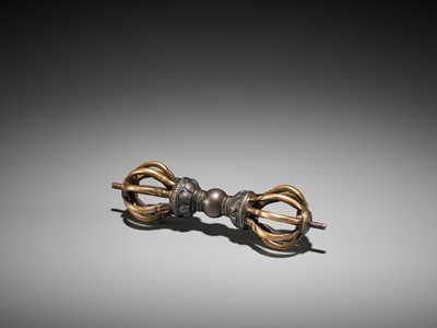 Lot 426 - A GILT-BRONZE AND IRON VAJRA, 17TH CENTURY