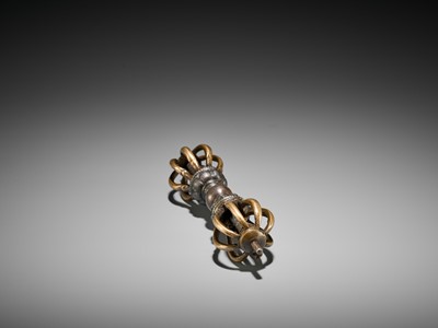 Lot 426 - A GILT-BRONZE AND IRON VAJRA, 17TH CENTURY