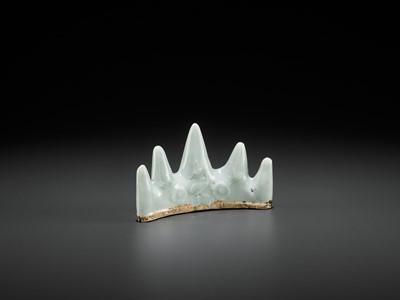 Lot 182 - A MOLDED QINGBAI ‘MOUNTAIN’ BRUSH REST, SOUTHERN SONG TO YUAN DYNASTY