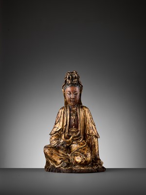 Lot 401 - A CARVED AND GILT-LACQUERED WOOD FIGURE OF GUANYIN, MING DYNASTY
