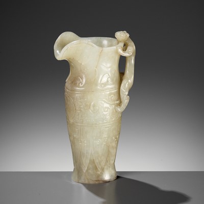 Lot 100 - AN IMPERIAL CELADON AND RUSSET JADE ‘CHILONG’ RHYTON, QIANLONG MARK AND PERIOD
