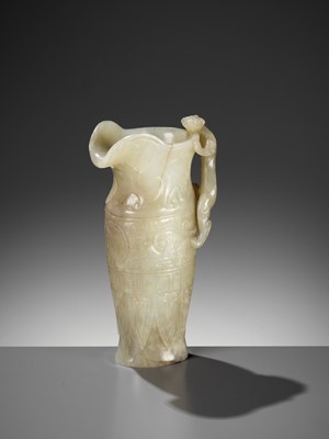 Lot 100 - AN IMPERIAL CELADON AND RUSSET JADE ‘CHILONG’ RHYTON, QIANLONG MARK AND PERIOD