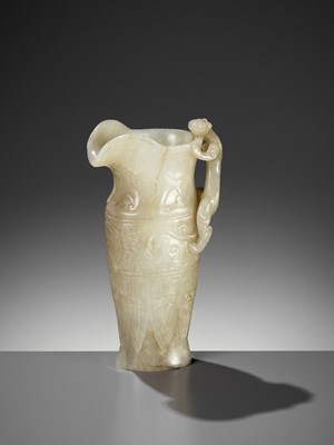 Lot 100 - AN IMPERIAL CELADON AND RUSSET JADE ‘CHILONG’ RHYTON, QIANLONG MARK AND PERIOD