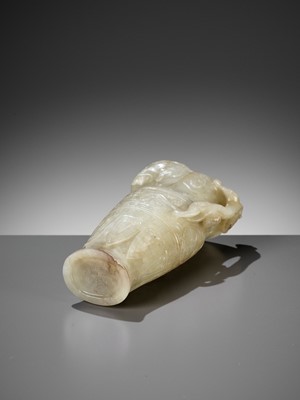 Lot 100 - AN IMPERIAL CELADON AND RUSSET JADE ‘CHILONG’ RHYTON, QIANLONG MARK AND PERIOD